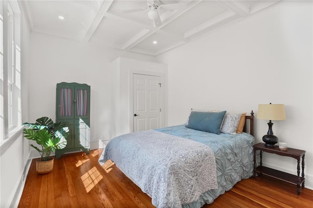 bedroom featuring multiple windows, coffered ceiling, wood-type flooring, and ceiling fan