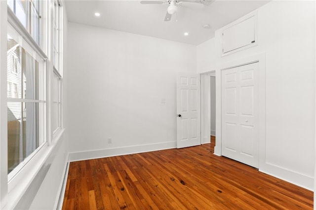 spare room with wood-type flooring and ceiling fan