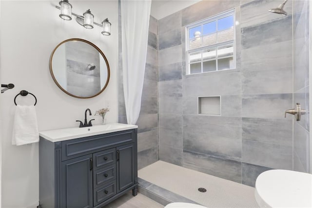 bathroom featuring vanity, a shower with curtain, and toilet