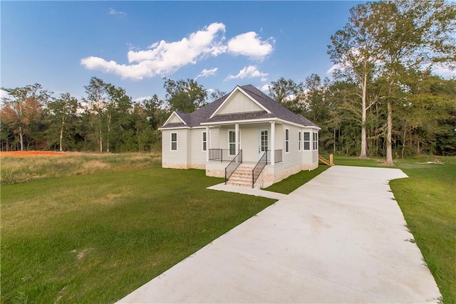 view of front facade with a front yard and a porch