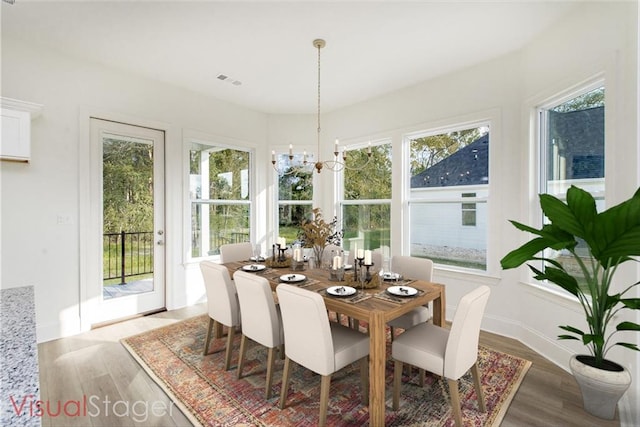 dining space featuring a healthy amount of sunlight and light hardwood / wood-style flooring