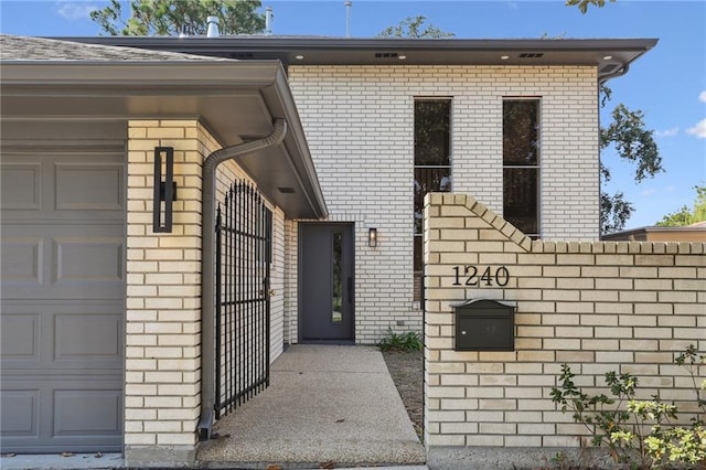 doorway to property featuring a garage