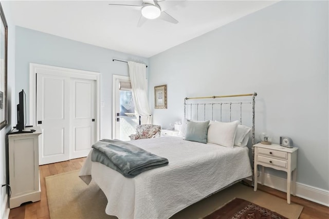 bedroom with light hardwood / wood-style flooring and ceiling fan