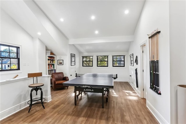 rec room with light hardwood / wood-style flooring and lofted ceiling