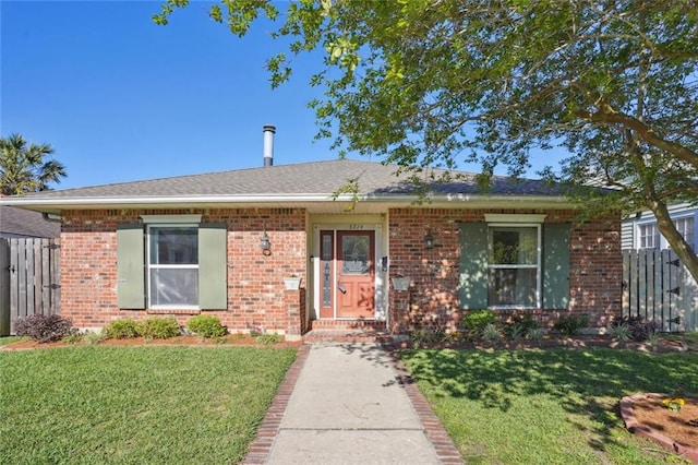 ranch-style house with a front lawn