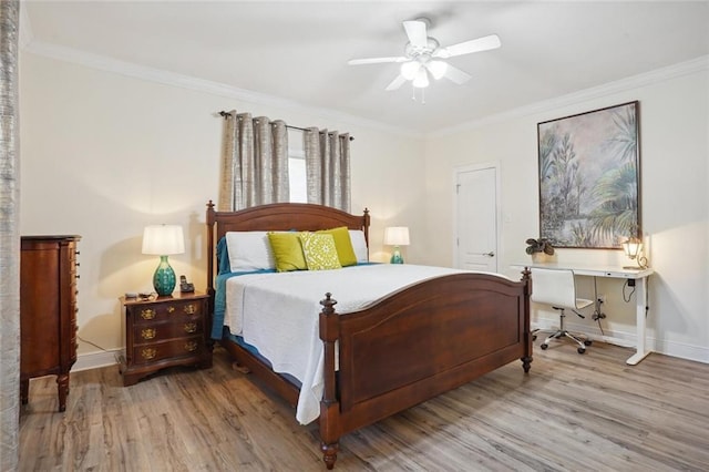 bedroom with ceiling fan, hardwood / wood-style floors, and crown molding