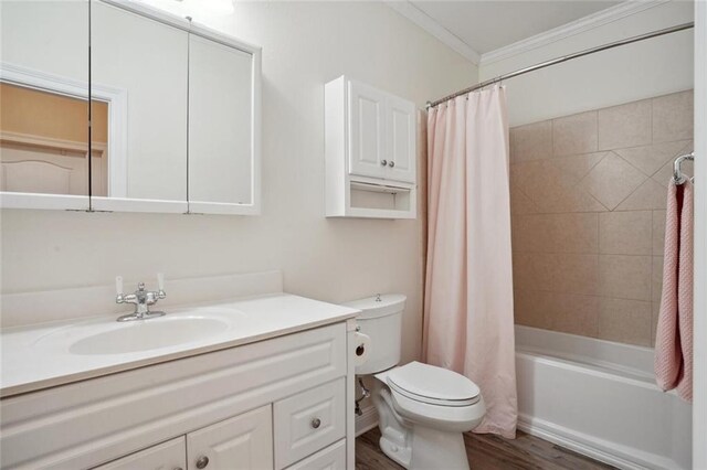 full bathroom with toilet, hardwood / wood-style floors, shower / bath combination with curtain, crown molding, and vanity