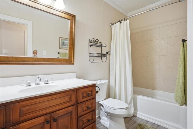 full bathroom featuring toilet, vanity, hardwood / wood-style floors, shower / bathtub combination with curtain, and ornamental molding