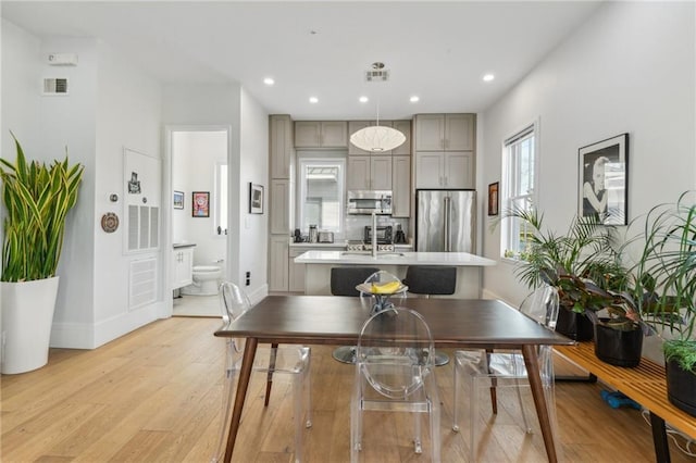 dining area with light hardwood / wood-style floors