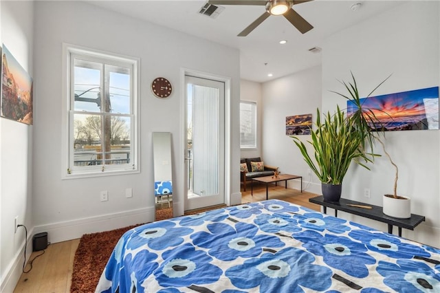 bedroom with ceiling fan and wood-type flooring