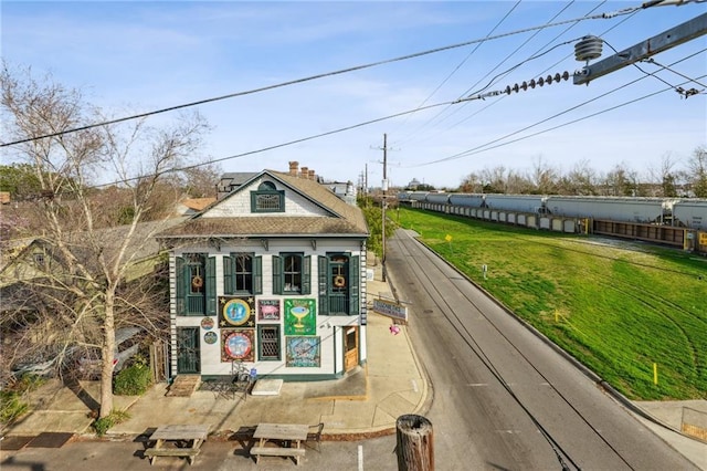 view of property exterior featuring a patio area and a yard