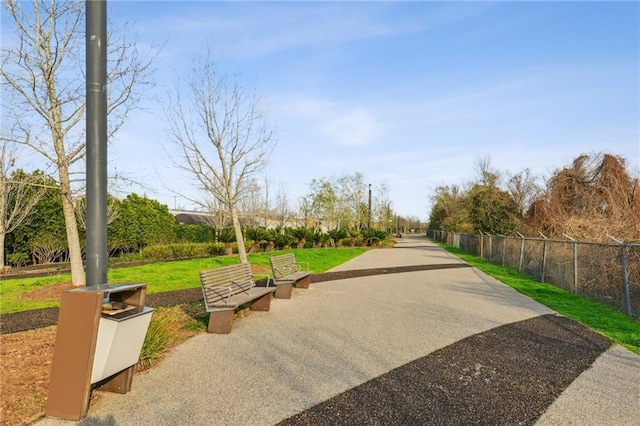 view of property's community featuring a yard