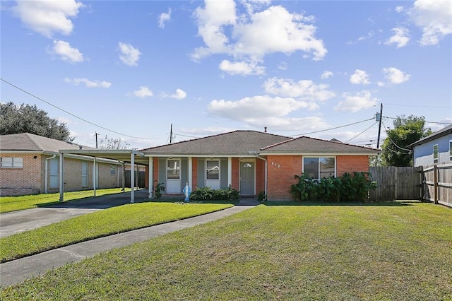 view of front of property with a front lawn and a carport