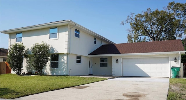 view of front of house featuring a front yard and a garage