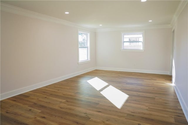 empty room with crown molding and dark hardwood / wood-style floors