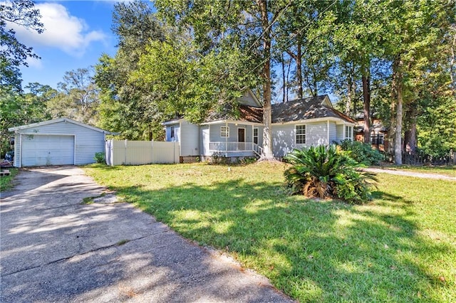 view of front of house featuring an outdoor structure, a front lawn, and a garage