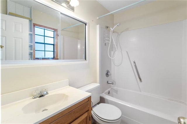 full bathroom featuring vanity, toilet, and washtub / shower combination