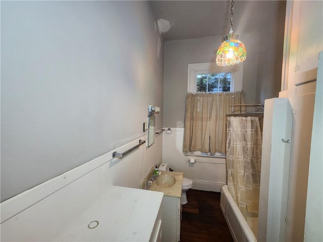 full bathroom featuring vanity, toilet, hardwood / wood-style flooring, and shower / bath combo