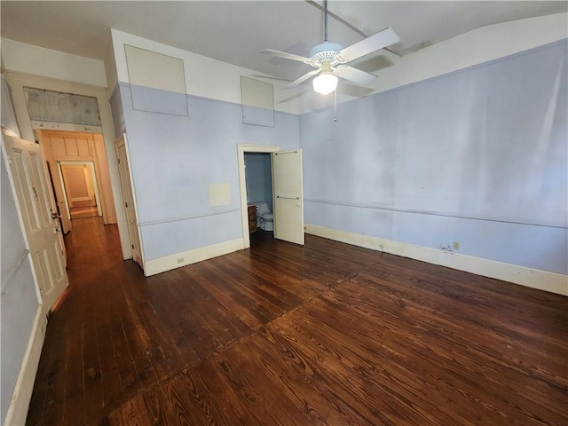 unfurnished bedroom with ceiling fan and dark hardwood / wood-style floors