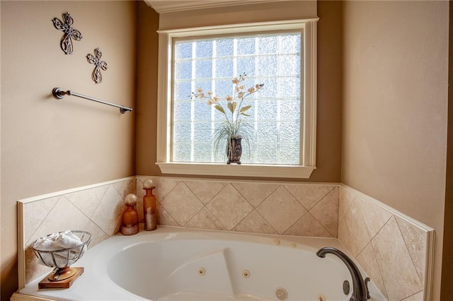 bathroom with a bathing tub and plenty of natural light