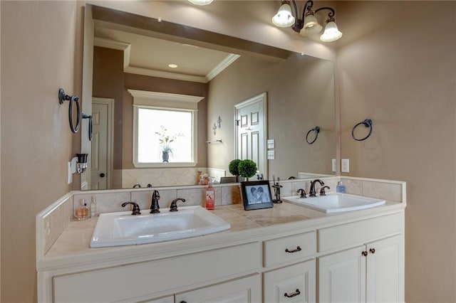 bathroom with vanity and ornamental molding