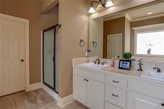 bathroom with vanity, ornamental molding, walk in shower, and tile patterned floors