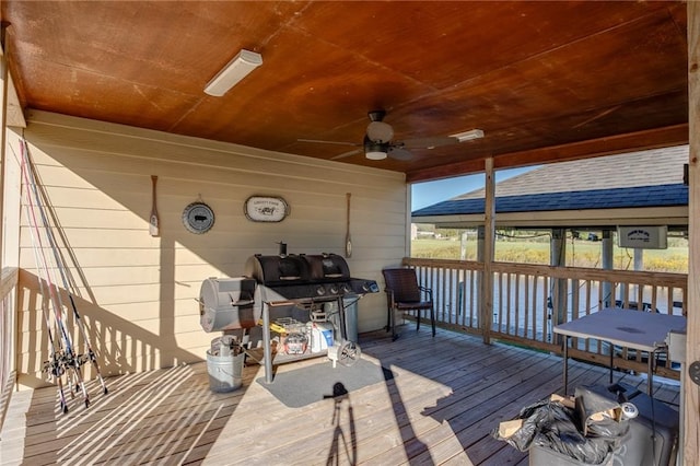 wooden terrace featuring ceiling fan