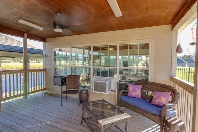 sunroom featuring wood ceiling, cooling unit, a healthy amount of sunlight, and ceiling fan