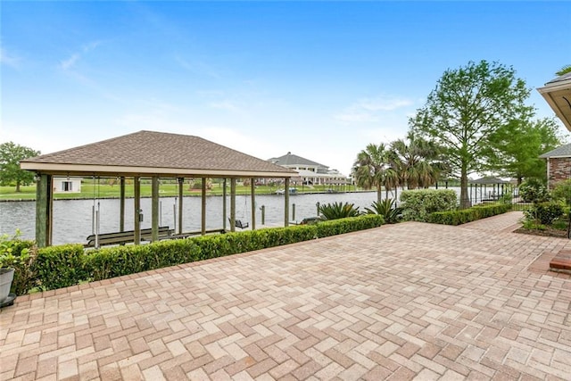 view of community with a dock and a water view