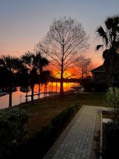 patio terrace at dusk with a water view