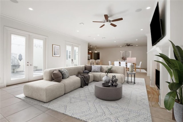 tiled living room with french doors, ceiling fan, and a wealth of natural light