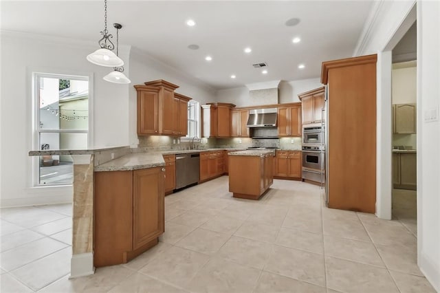 kitchen with range hood, crown molding, decorative backsplash, and a kitchen island