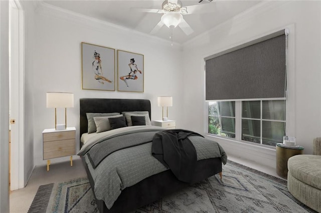 bedroom with crown molding, light colored carpet, and ceiling fan