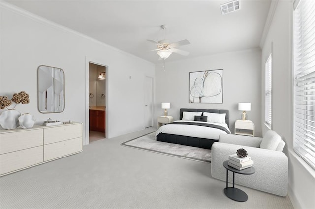 carpeted bedroom featuring ornamental molding, multiple windows, and ceiling fan