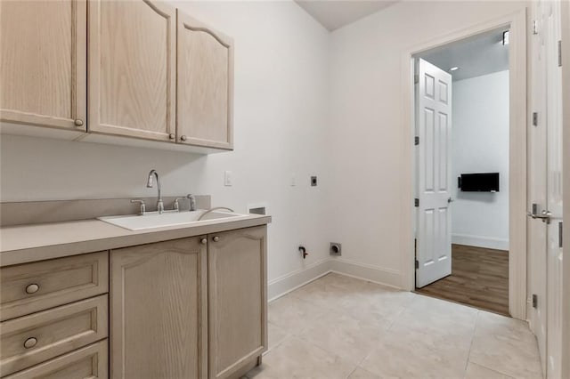 laundry room featuring cabinets, washer hookup, light tile patterned floors, electric dryer hookup, and sink