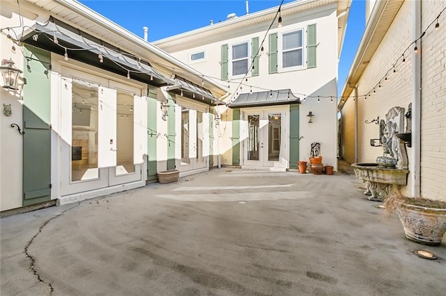 back of house featuring french doors and a patio area