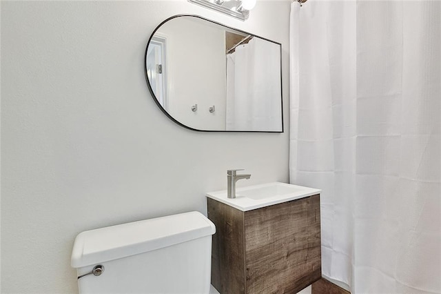 bathroom with toilet and vanity