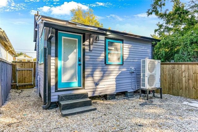 rear view of house with ac unit