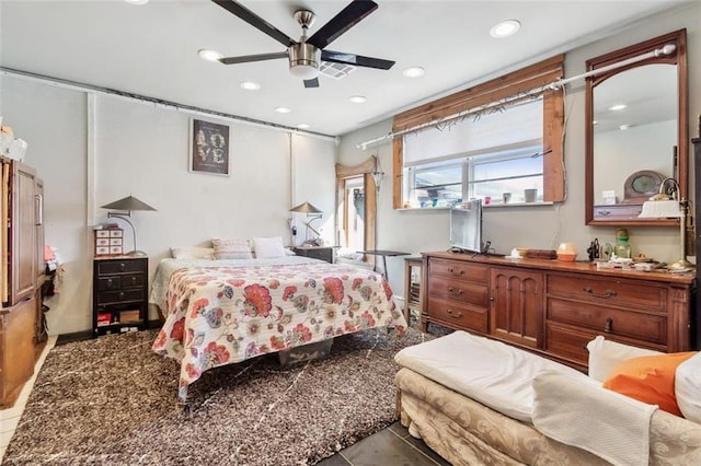 bedroom featuring tile patterned floors and ceiling fan