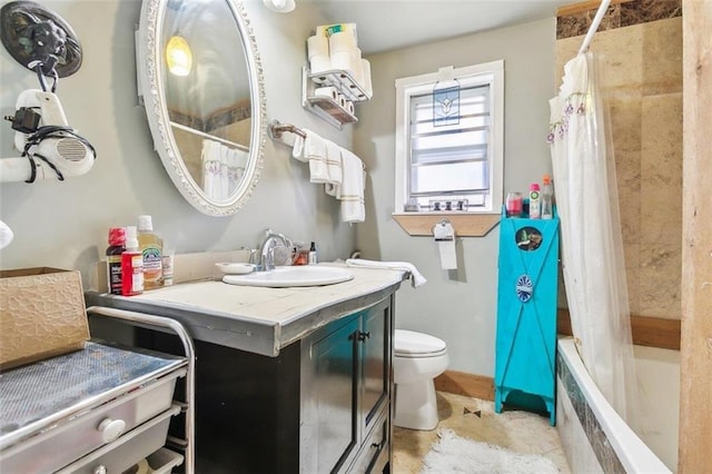 full bathroom featuring vanity, tile patterned flooring, toilet, and shower / tub combo