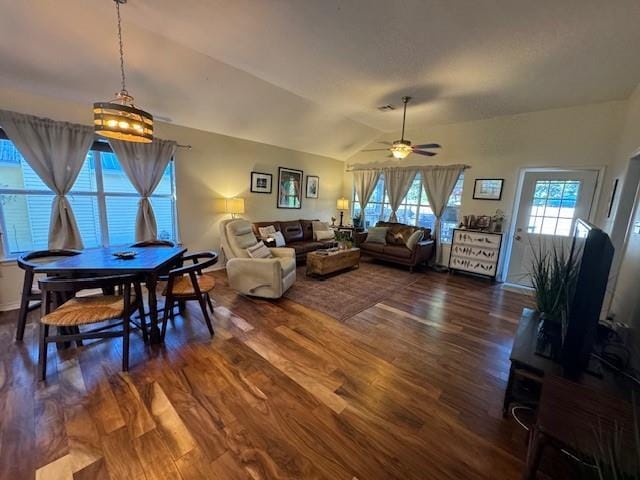 living room with lofted ceiling, hardwood / wood-style floors, and ceiling fan