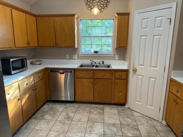 kitchen with sink and appliances with stainless steel finishes