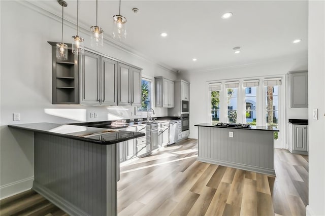 kitchen with gray cabinets, black appliances, kitchen peninsula, and pendant lighting