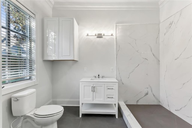 bathroom featuring vanity, toilet, ornamental molding, and a wealth of natural light