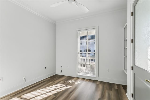 spare room with dark wood-type flooring, ceiling fan, crown molding, and plenty of natural light