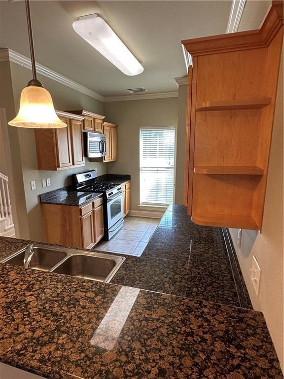 kitchen with dark countertops, crown molding, appliances with stainless steel finishes, granite finish floor, and open shelves