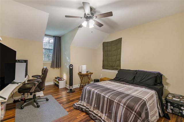 bedroom with dark wood-type flooring, vaulted ceiling, and ceiling fan