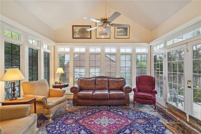 sunroom with a wealth of natural light, vaulted ceiling, and ceiling fan