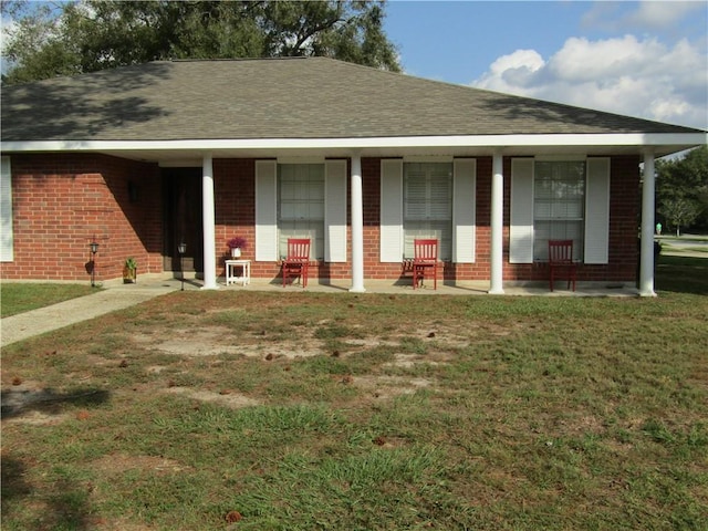 ranch-style house featuring a patio area and a front yard