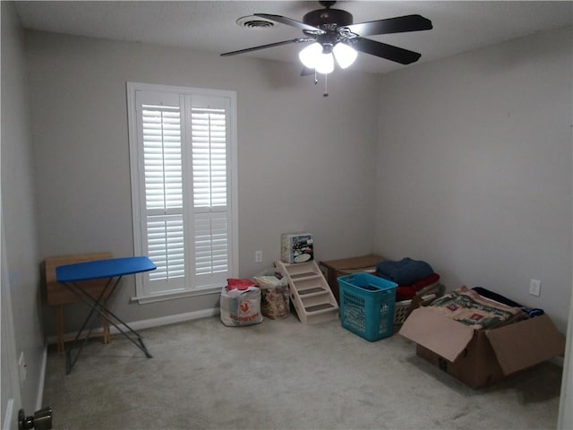 misc room featuring ceiling fan and carpet floors